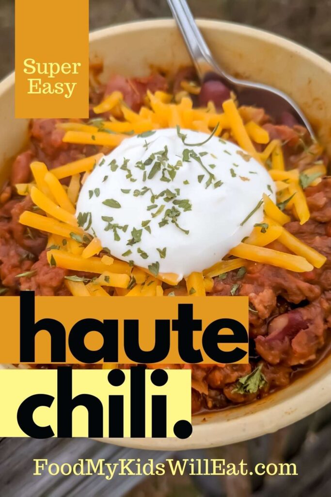 Haute Chili. Yummm. 4 Photo of chili topped with cheddar cheese and sour cream overlooking fall vibes.