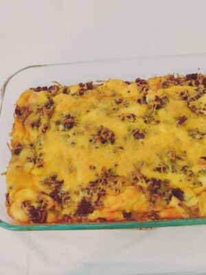 Photograph of Strata - an egg and sausage casserole with cheddar cheese