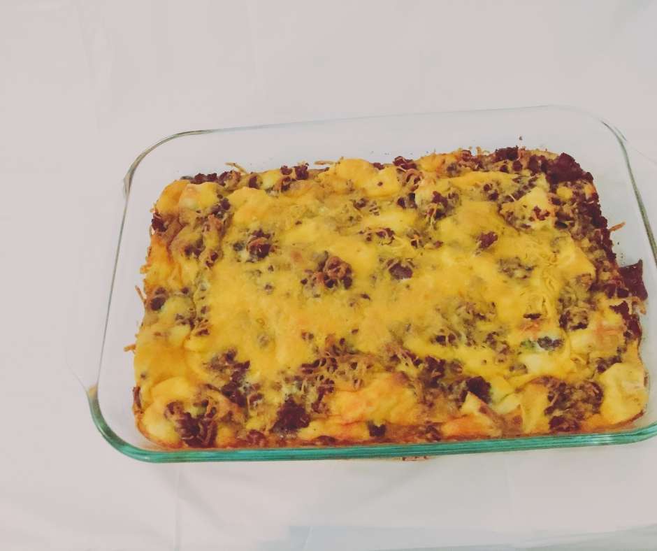Photograph of Strata - an egg and sausage casserole with cheddar cheese