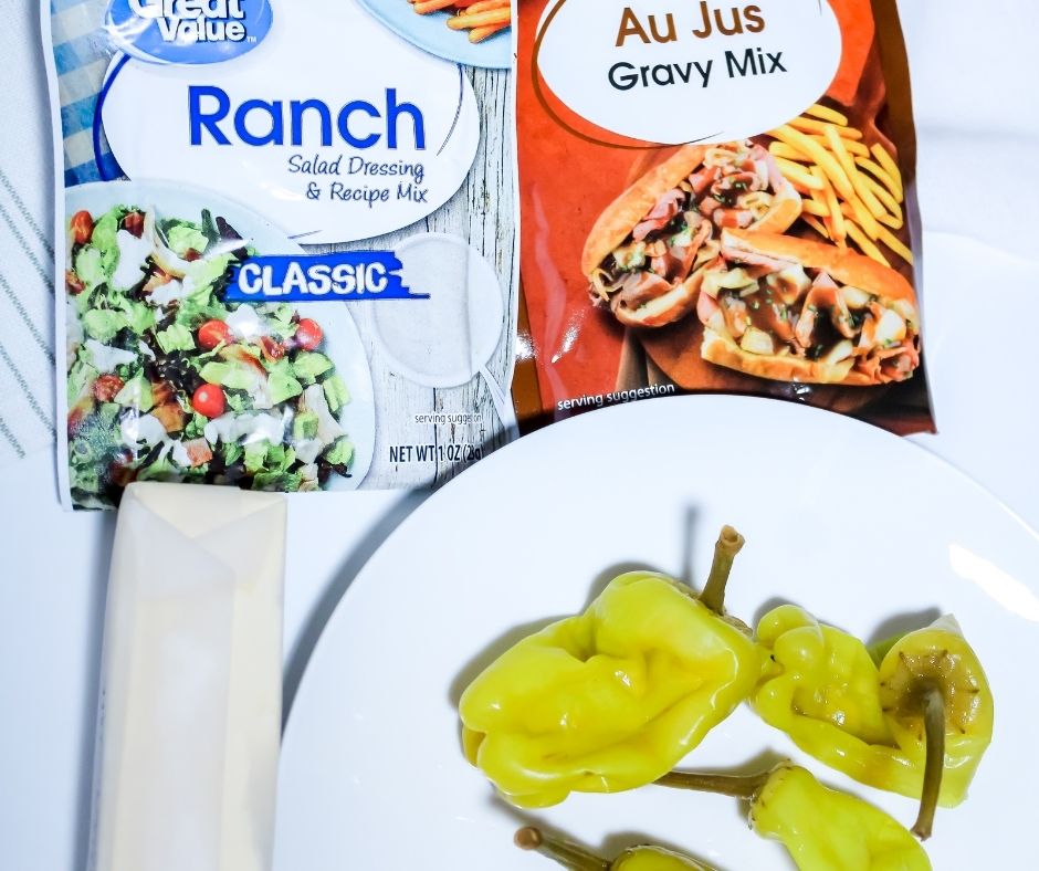 Ingredients for Mississippi Roast: Packet of Ranch, Packet of Au Jus Sauce, Butter, Pepperoncini Peppers. I did not include a picture of the roast itself because raw meat is gross to look at.