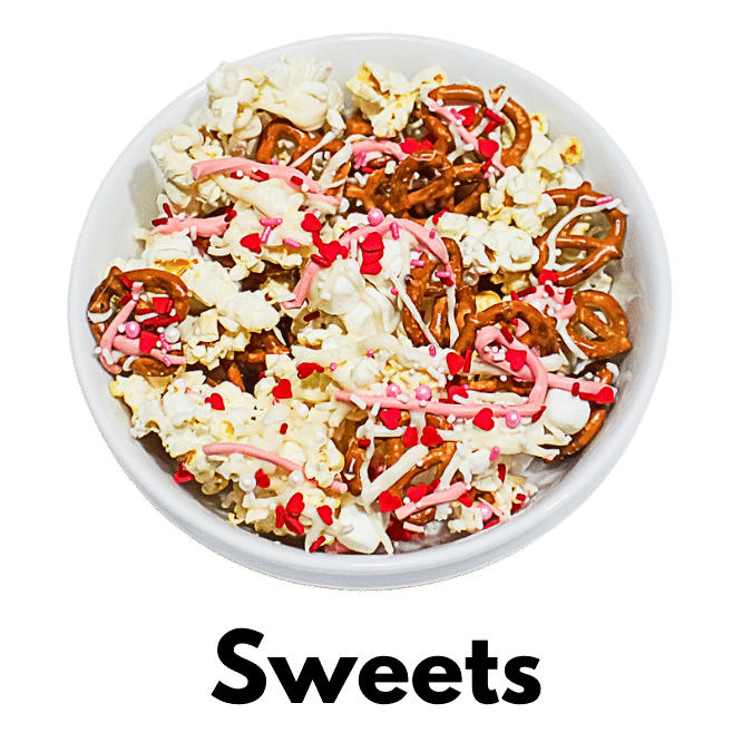 Category Sweets with photo of bowl of popcorn, pretzels and marshmallows drizzled with strawberry chocolate candies and heart sprinkles.